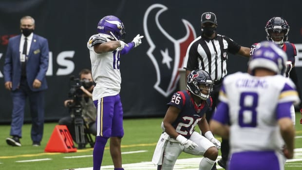 Oct 4, 2020; Houston, Texas, USA; Minnesota Vikings wide receiver Justin Jefferson (18) signals after making a reception against the Houston Texans for a first down during the second quarter at NRG Stadium.