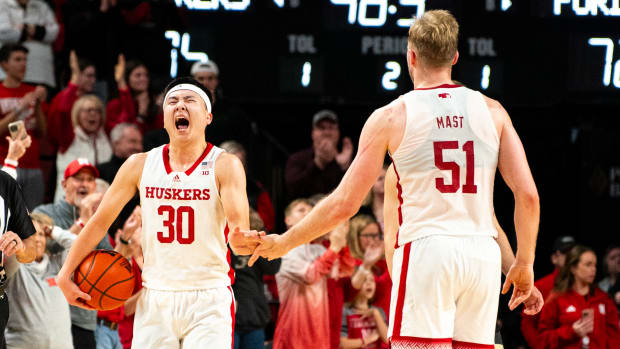 Nebraska Cornhuskers guard Keisei Tominaga (30) and forward Rienk Mast (51) celebrate at the end of the game against the Purdue Boilermakers at Pinnacle Bank Arena.