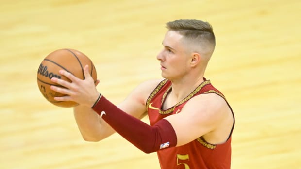 Mar 10, 2024; Cleveland, Ohio, USA; Cleveland Cavaliers guard Sam Merrill (5) shoots a three-point basket in the third quarter against the Brooklyn Nets at Rocket Mortgage FieldHouse.