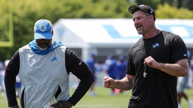 Detroit Lions coach Dan Campbell (right) talks to general manager Brad Holmes (left) after the joint practice with the New York Giants.