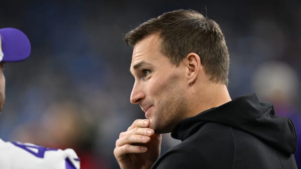 Jan 7, 2024; Detroit, Michigan, USA; Minnesota Vikings quarterback Kirk Cousins (8) talks with teammates prior to their game against the Detroit Lions at Ford Field.