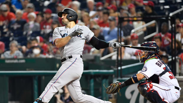 Jul 20, 2021; Washington, District of Columbia, USA; Miami Marlins left fielder Adam Duvall (14) hits a three run home run against the Washington Nationals during the sixth inning at Nationals Park. Mandatory Credit: Brad Mills-USA TODAY Sports  