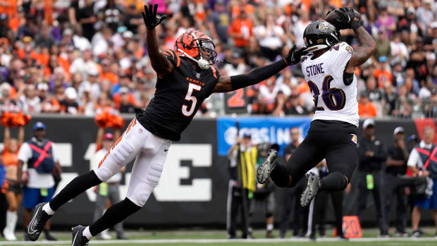 Baltimore Ravens safety Geno Stone (26) intercepts a pass intended for Cincinnati Bengals wide receiver Tee Higgins (5) in the third quarter of a Week 2 NFL football game between the Baltimore Ravens and the Cincinnati Bengals Sunday, Sept. 17, 2023, at Paycor Stadium in Cincinnati.