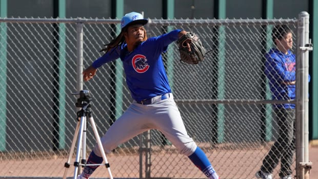 Feb 16, 2024; Mesa, AZ, USA; Chicago Cubs starting pitcher Michael Arias (82) throws in the bullpen during Spring Training camp at Sloan Park. Mandatory Credit: Rick Scuteri-USA TODAY Sports
