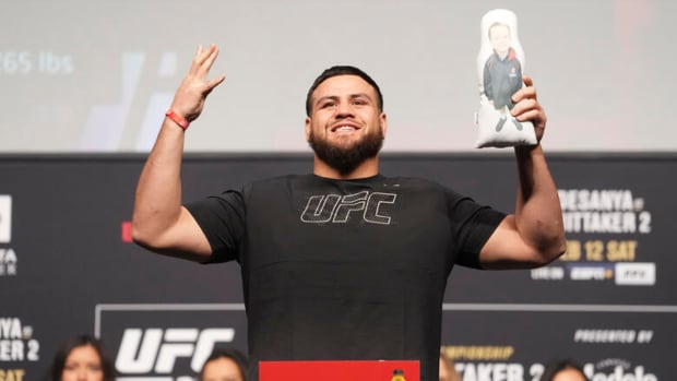 Tai Tuivasa tips the scales for the official UFC weigh-ins.