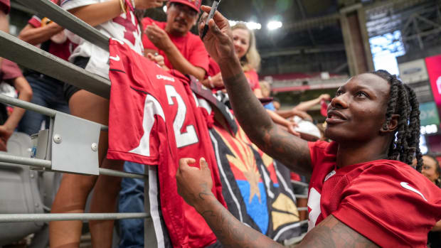 Arizona Cardinals wide receiver Marquise Brown (2) signs autographs during the Arizona Cardinals training camp at State Farm Stadium in Glendale on July 29, 2023.  