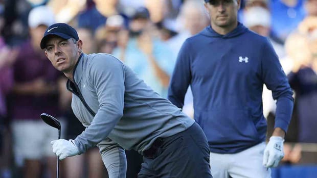 Rory McIlroy, left, eyes his shot from the 10th tee as Jordan Spieth looks on during the first round of the 2024 Players Championship at TPC Sawgrass in Ponte Vedra Beach, Fla.
