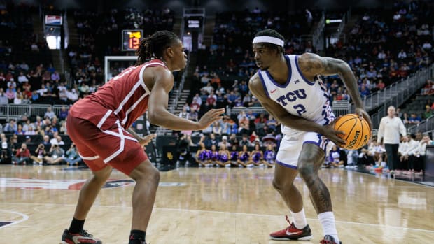 Mar 13, 2024; Kansas City, MO, USA; Oklahoma Sooners guard Otega Oweh (3) guards TCU Horned Frogs forward Emanuel Miller (2) during the first half at T-Mobile Center.