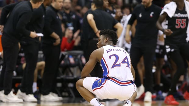 Kansas junior forward KJ Adams Jr. (24) reacts after a play against Cincinnati in the second half of the Big 12 Conference Tournament second round game Wednesday, March 13, 2024, inside the T-Mobile Center in Kansas City, Mo.  