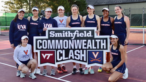 The Virginia women's tennis team celebrates after defeating Virginia Tech 6-1 in the Commonwealth Clash.