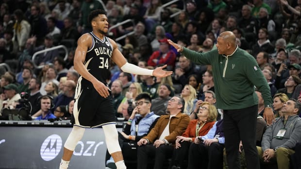 ; Milwaukee Bucks forward Giannis Antetokounmpo (34) is greeted by head coach Doc Rivers 