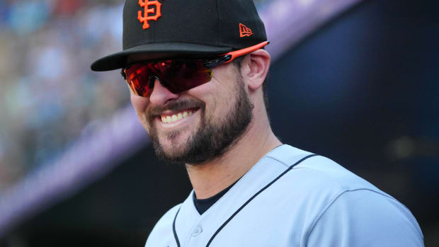 Sep 17, 2023; Denver, Colorado, USA; San Francisco Giants third baseman J.D. Davis (7) reacts in the seventh inning against the Colorado Rockies at Coors Field.