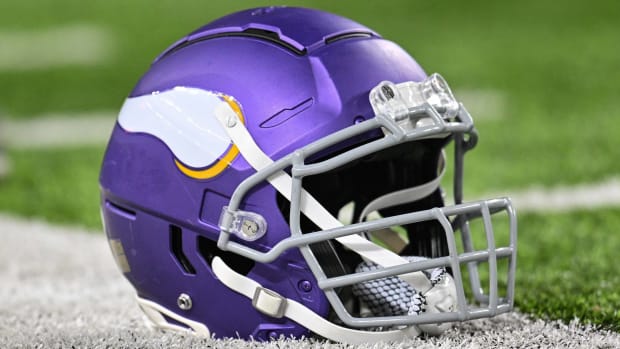 A Minnesota Vikings helmet sits on the field before a game.