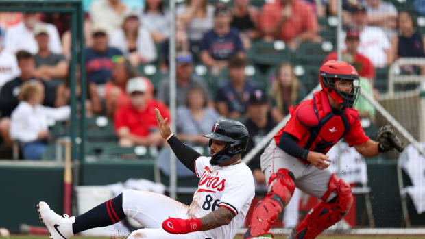Minnesota Twins catcher Chris Williams scores a run against the Boston Red Sox in the sixth inning at Hammond Stadium in Fort Myers, Fla., on March 6, 2024.