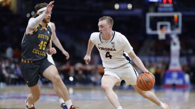 Andrew Rohde drives the ball during the Virginia men's basketball game against Boston College in the quarterfinals of the 2024 ACC Men's Basketball Tournament at Capital One Arena.