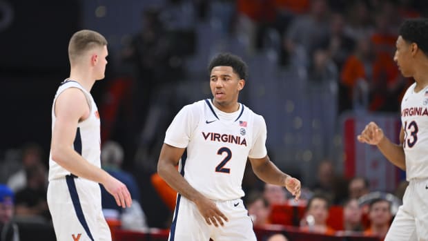 Reece Beekman talks to Isaac McKneely during the Virginia men's basketball game against Boston College in the quarterfinals of the 2024 ACC Men's Basketball Tournament at Capital One Arena.