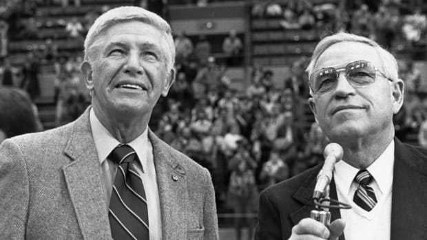 Former UW athletic director Mike Lude, at right, shares a UW moment with his basketball coach, Marv Harshman.