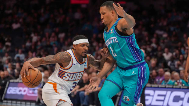Phoenix Suns guard Bradley Beal (3) drives to the basket against Charlotte Hornets forward Grant Williams (2) during the first quarter at Spectrum Center.