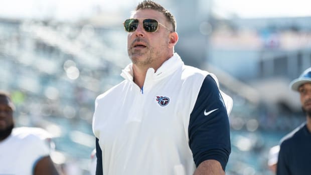 Titans head coach Mike Vrabel walks onto the field before a game.