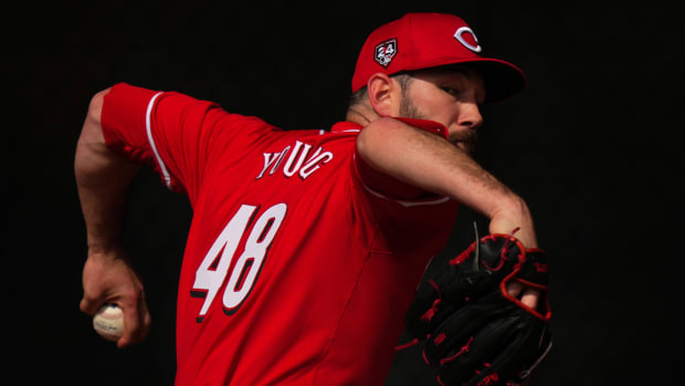 Cincinnati Reds relief pitcher Alex Young (48) throws in the bullpen during spring training workouts, Friday, Feb. 23, 2024, at the team's spring training facility in Goodyear, Ariz.