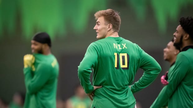 Oregon quarterback Bo Nix warms up during Oregon Pro Day Tuesday, March 12, 2024 at the Moshofsky Center in Eugene, Ore.