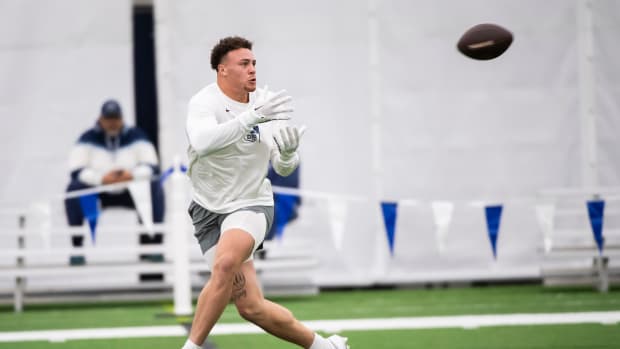 Penn State tight end Theo Johnson catches passes during Pro Day at Holuba Hall in State College.