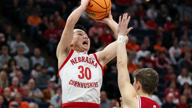 Mar 15, 2024; Minneapolis, MN, USA; Nebraska Cornhuskers guard Keisei Tominaga (30) shoots as Indiana Hoosiers guard Gabe Cupps (2) defends during the first half at Target Center.