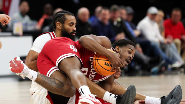 Indiana Hoosiers guard Xavier Johnson (0) and Nebraska Cornhuskers guard Brice Williams (3) compete for the ball during the first half at Target Center. 