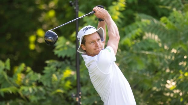 Peter Malnati hits his tee shot on the second hole during the first round of the John Deere Classic golf tournament.