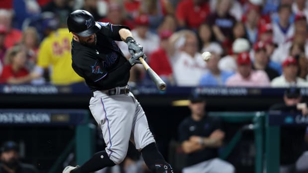 Oct 4, 2023; Philadelphia, Pennsylvania, USA; Miami Marlins shortstop Jon Berti (5) hits a double against the Philadelphia Phillies during the third inning for game two of the Wildcard series for the 2023 MLB playoffs at Citizens Bank Park. Mandatory Credit: Bill Streicher-USA TODAY Sports  