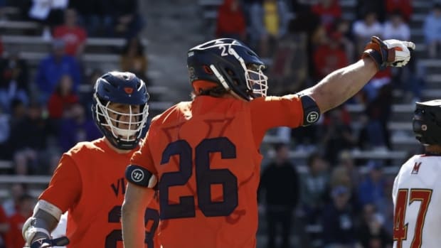 Griffin Schutz celebrates after scoring a goal during the Virginia men's lacrosse game against Maryland at SECU Stadium in College Park.