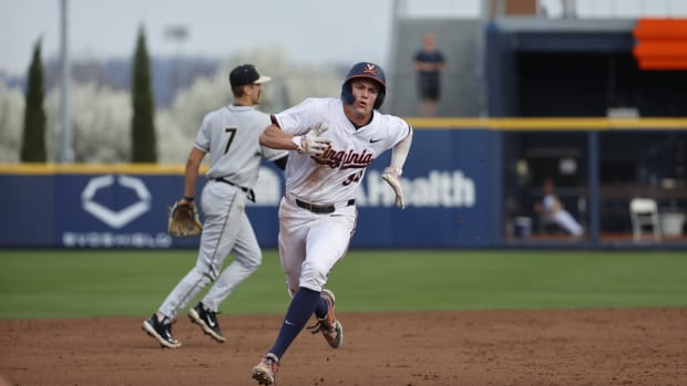 Harrison Didawick runs from second base to third base during the Virginia baseball game against Wake Forest at Disharoon Park.