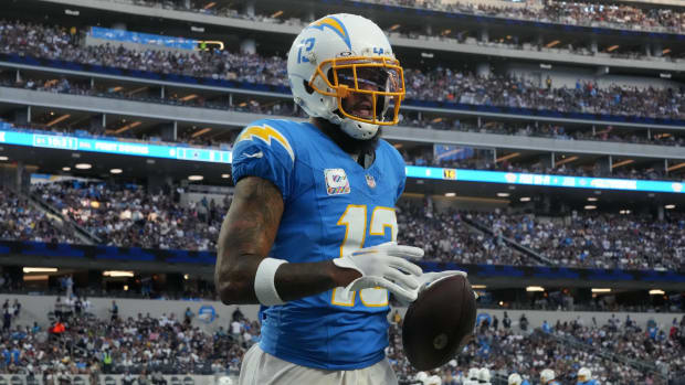 Chargers wide receiver Keenan Allen holds onto a ball in a game.