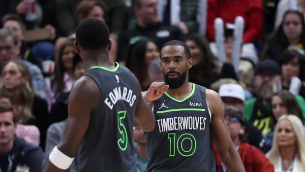 Mar 16, 2024; Salt Lake City, Utah, USA; Minnesota Timberwolves guard Mike Conley (10) reacts to a play against the Utah Jazz with guard Anthony Edwards (5) during the second quarter at Delta Center.