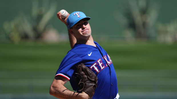 Texas Rangers starting pitcher Cody Bradford (61) pitches against the Los Angeles Angels during the first inning at Surprise Stadium.
