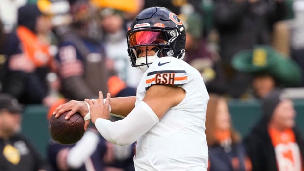 Jan 7, 2024; Green Bay, Wisconsin, USA; Chicago Bears quarterback Justin Fields (1) throws a pass during warmups prior to the game against the Green Bay Packers at Lambeau Field.