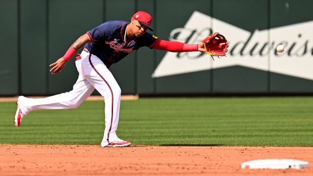 Mar 5, 2024; North Port, Florida, USA; Atlanta Braves shortstop Orlando Arcia (11) reaches for a ground ball in the third inning of the spring training game against the Detroit Tigers at CoolToday Park. Mandatory Credit: Jonathan Dyer-USA TODAY Sports  