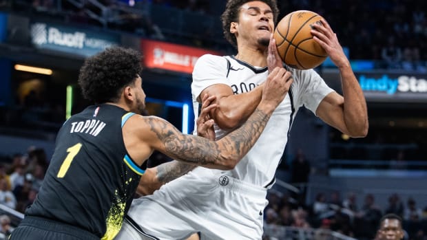 Brooklyn Nets forward Cameron Johnson (2) is fouled by Indiana Pacers forward Obi Toppin (1)