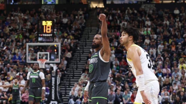 Mar 16, 2024; Salt Lake City, Utah, USA; Minnesota Timberwolves guard Mike Conley (10) holds a follow through after a shot against the Utah Jazz during the fourth quarter at Delta Center