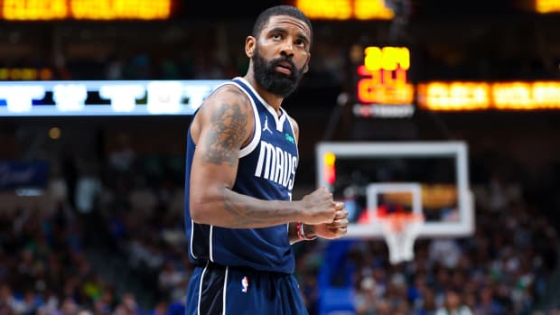 Dallas Mavericks point guard Kyrie Irving reacts during his team’s game against the Denver Nuggets on March 17, 2024.