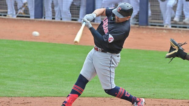 Feb 26, 2024; Peoria, Arizona, USA; Cleveland Guardians first baseman Josh Naylor (22) singles in the third inning against the San Diego Padres during a spring training game at Peoria Sports Complex.
