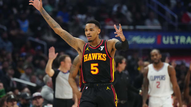 Mar 17, 2024; Los Angeles, California, USA; Atlanta Hawks guard Dejounte Murray (5) celebrates against the LA Clippers in the first half at Crypto.com Arena. Mandatory Credit: Kirby Lee-USA TODAY Sports