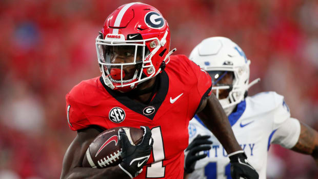 Georgia wide receiver Marcus Rosemy-Jacksaint (1) drives in for a touchdown during the first half of a NCAA college football game against Kentucky in Athens, Ga., on Saturday, Oct. 7, 2023.