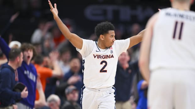 Reece Beekman celebrates on the court during the Virginia men's basketball game against Boston College in the quarterfinals of the 2024 ACC Men's Basketball Tournament at Capital One Arena.