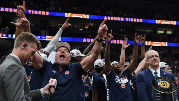Auburn Tigers head coach Bruce Pearl celebrates after defeating the Florida Gators in the SEC Tournament championship game at Bridgestone Arena in Nashville, Tenn., on March 17, 2024.
