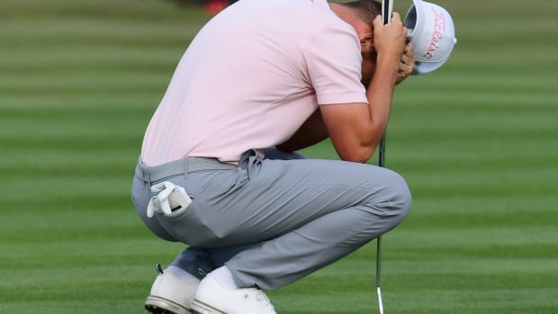 Wyndham Clark reacts after missing a close birdie putt on hole 18 that would have put him at 20 under par and tied with the lead during the fourth and final round of The Players Championship PGA golf tournament Sunday, March 17, 2024 at TPC Sawgrass in Ponte Vedra Beach, Fla.