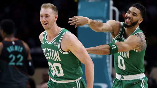 Sam Hauser celebrates with Jayson Tatum after hitting a three-pointer during the Boston Celtics game against the Washington Wizards at Capital One Arena.