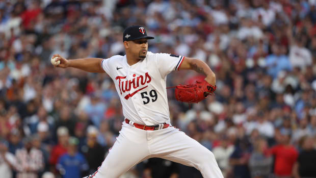 Oct 4, 2023; Minneapolis, Minnesota, USA; Minnesota Twins relief pitcher Jhoan Duran (59) delivers a pitch in the ninth inning against the Toronto Blue Jays during game two of the Wildcard series for the 2023 MLB playoffs at Target Field.