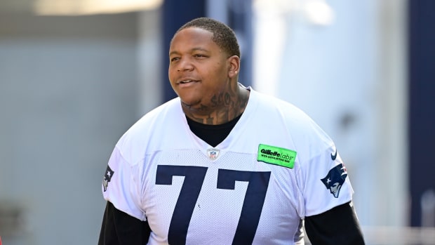 Jul 26, 2023; Foxborough, MA, USA; New England Patriots offensive tackle Trent Brown (77) makes his way to the practice fields for training camp at Gillette Stadium. Mandatory Credit: Eric Canha-USA TODAY Sports  