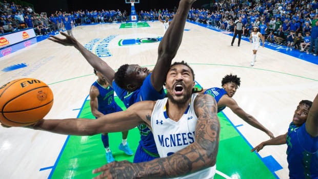 McNeese's Christian Shumate is blocked by TAMUCC's Stephen Giwa during the game at the American Bank Center on Monday, Jan. 22, 2024, in Corpus Christi, Texas.  